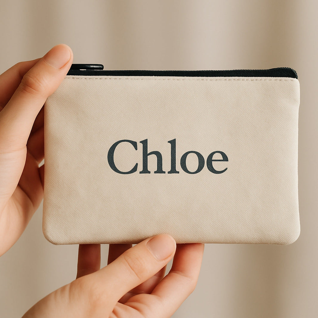 Custom toiletry bag — small 21x12cm personalised pouch with the name Chloe in hand
