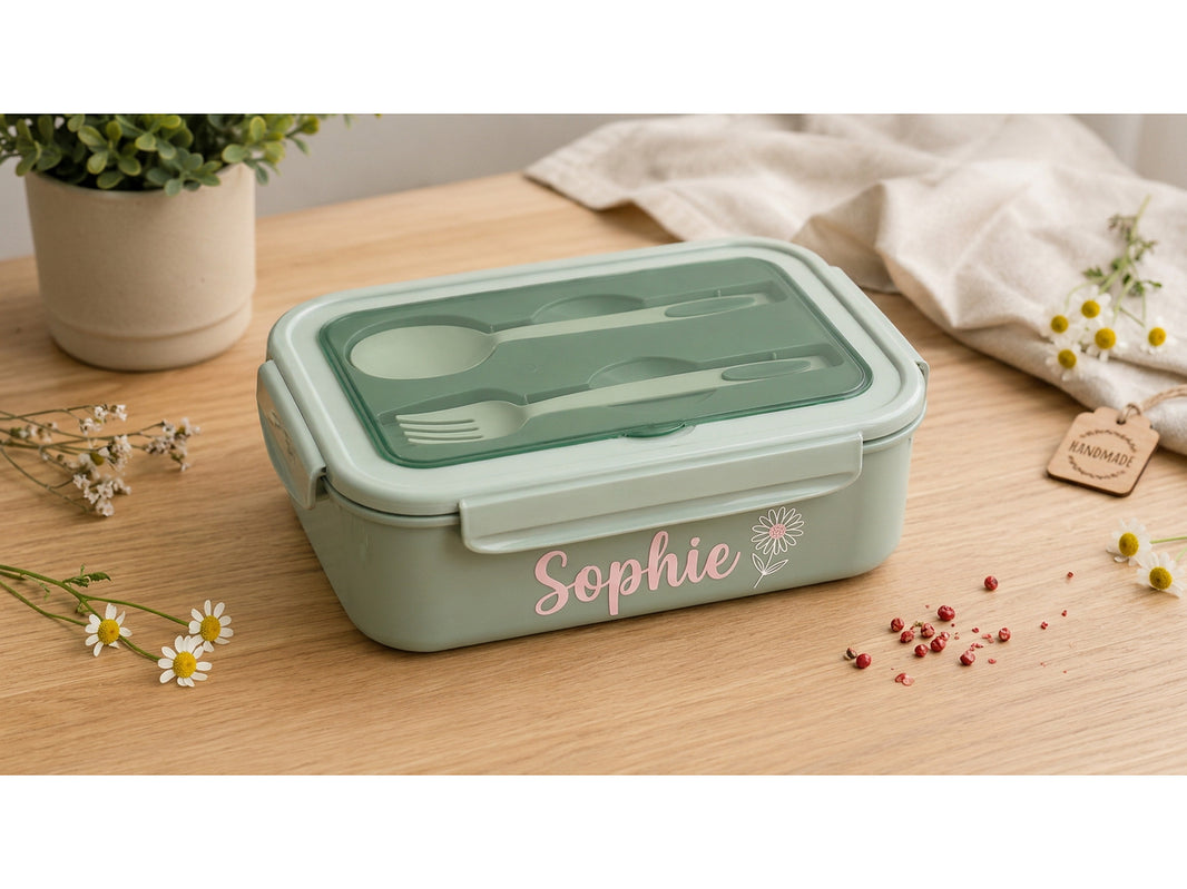 Personalised bento lunch box with the name Sophie in pink script lettering and a daisy