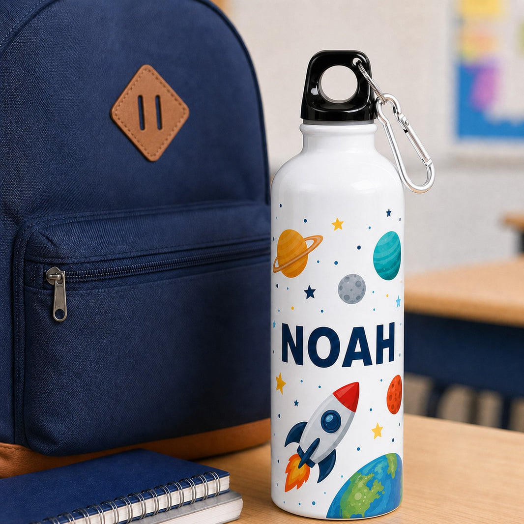 Kids water bottle with space rocket design and the name Noah next to a school backpack