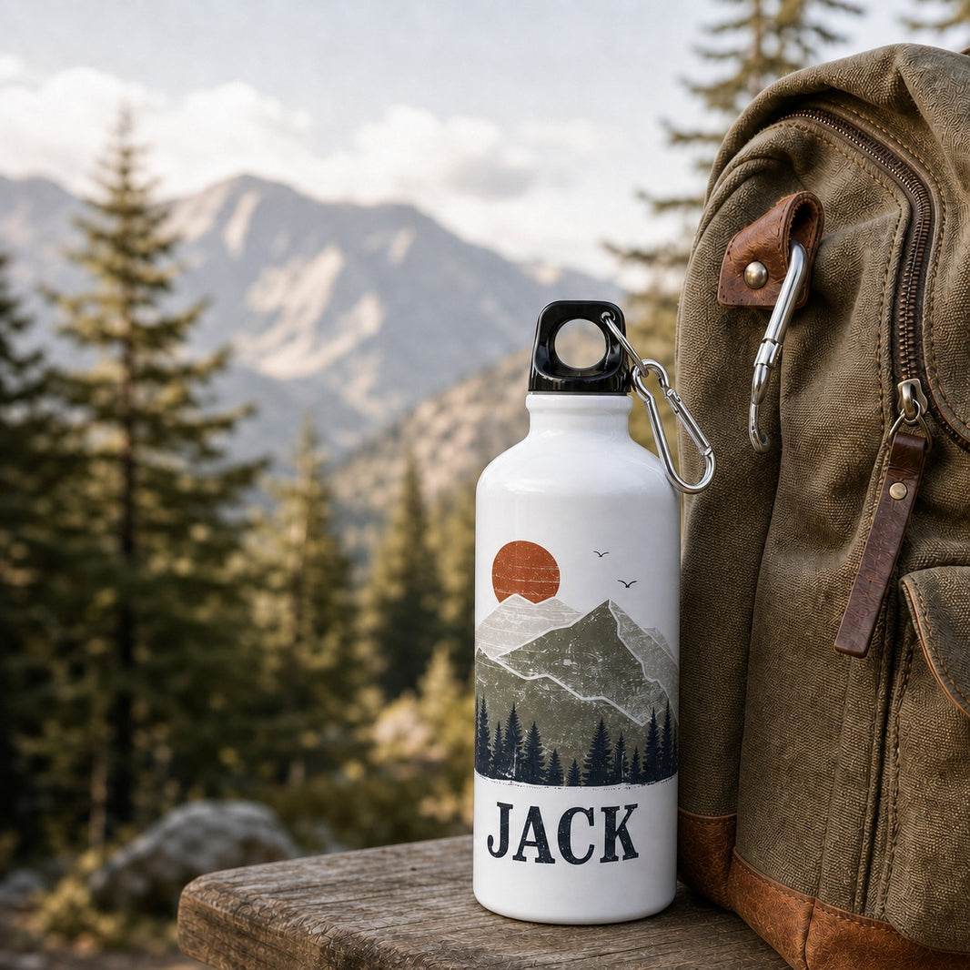 Personalised water bottle with mountain scene design and the name Jack on a hiking trail