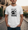 Man wearing a white t-shirt with 'Live Love Travel' design on a street background
