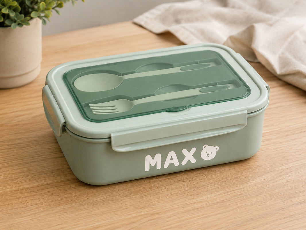 Green bento lunch box personalised with the name Max and a teddy bear face icon