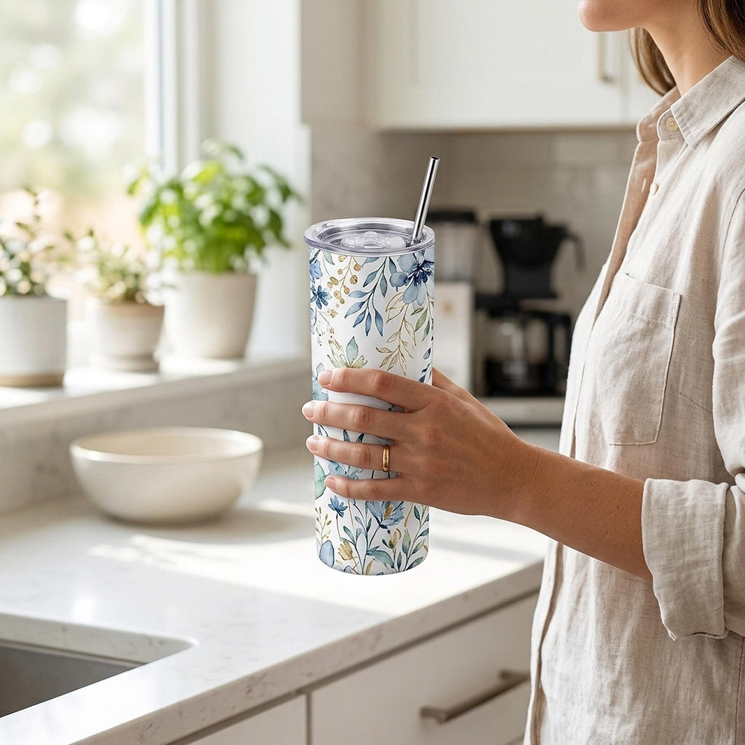 Tumbler with straw held by a woman in a bright kitchen — personalised 20oz design