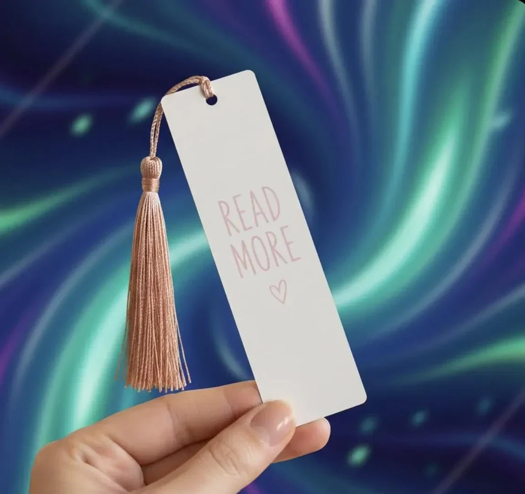 Custom name tassel bookmark in use inside a book, reading gift