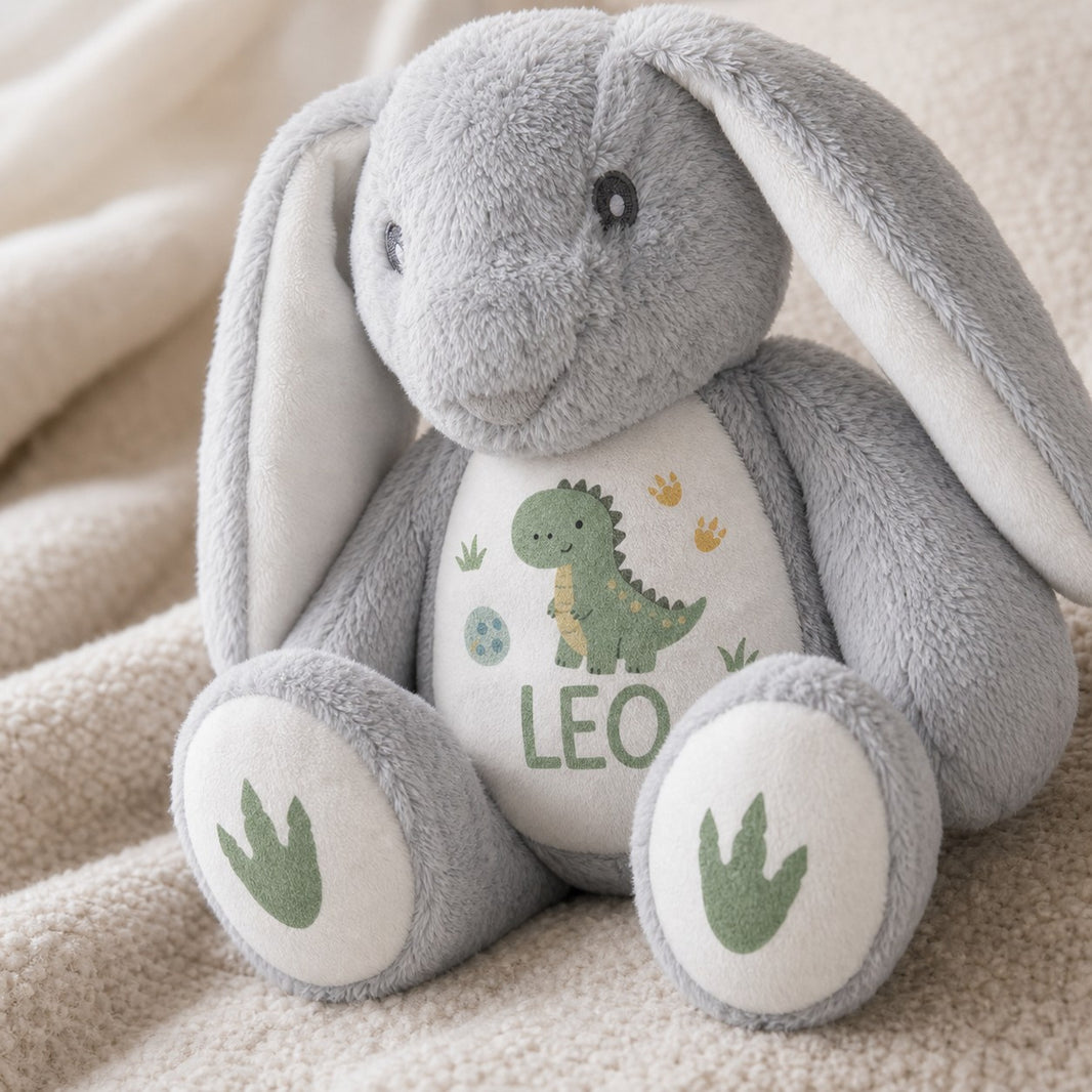 Personalised bunny plush with green dinosaur design and the name Leo, dinosaur footprint foot pads