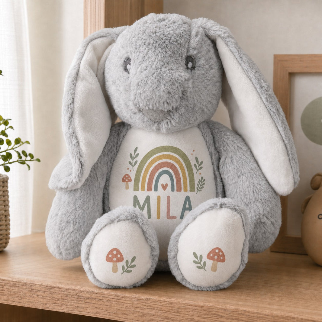 Personalised bunny plush with boho rainbow design and the name Mila with mushroom foot pads
