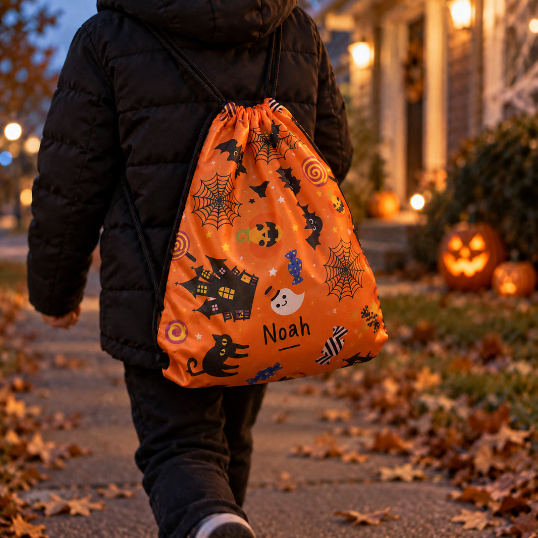Child wearing a personalised Noah Halloween drawstring backpack while trick or treating at dusk