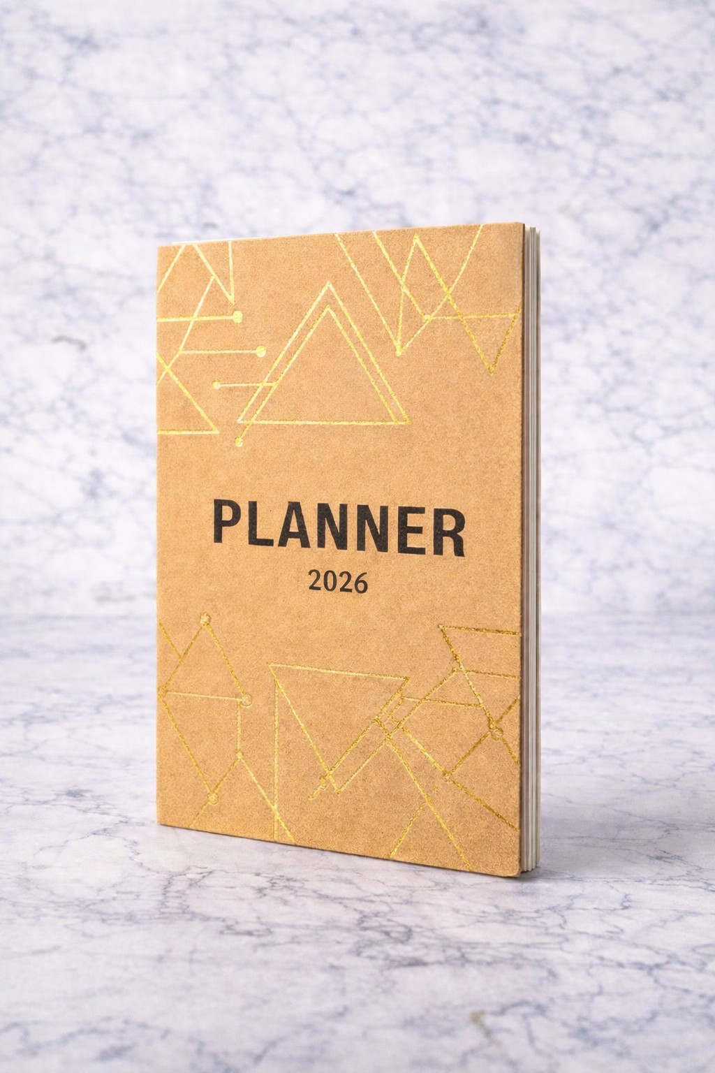 Planner 2026 with geometric design on a marble surface