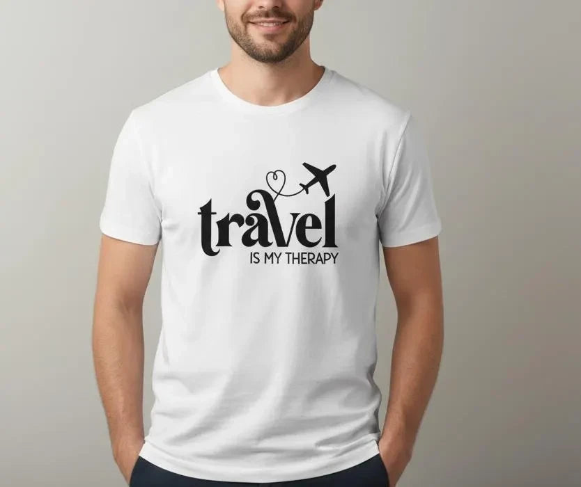 Person wearing a white t-shirt with 'Travel is my Therapy' text and airplane icon.