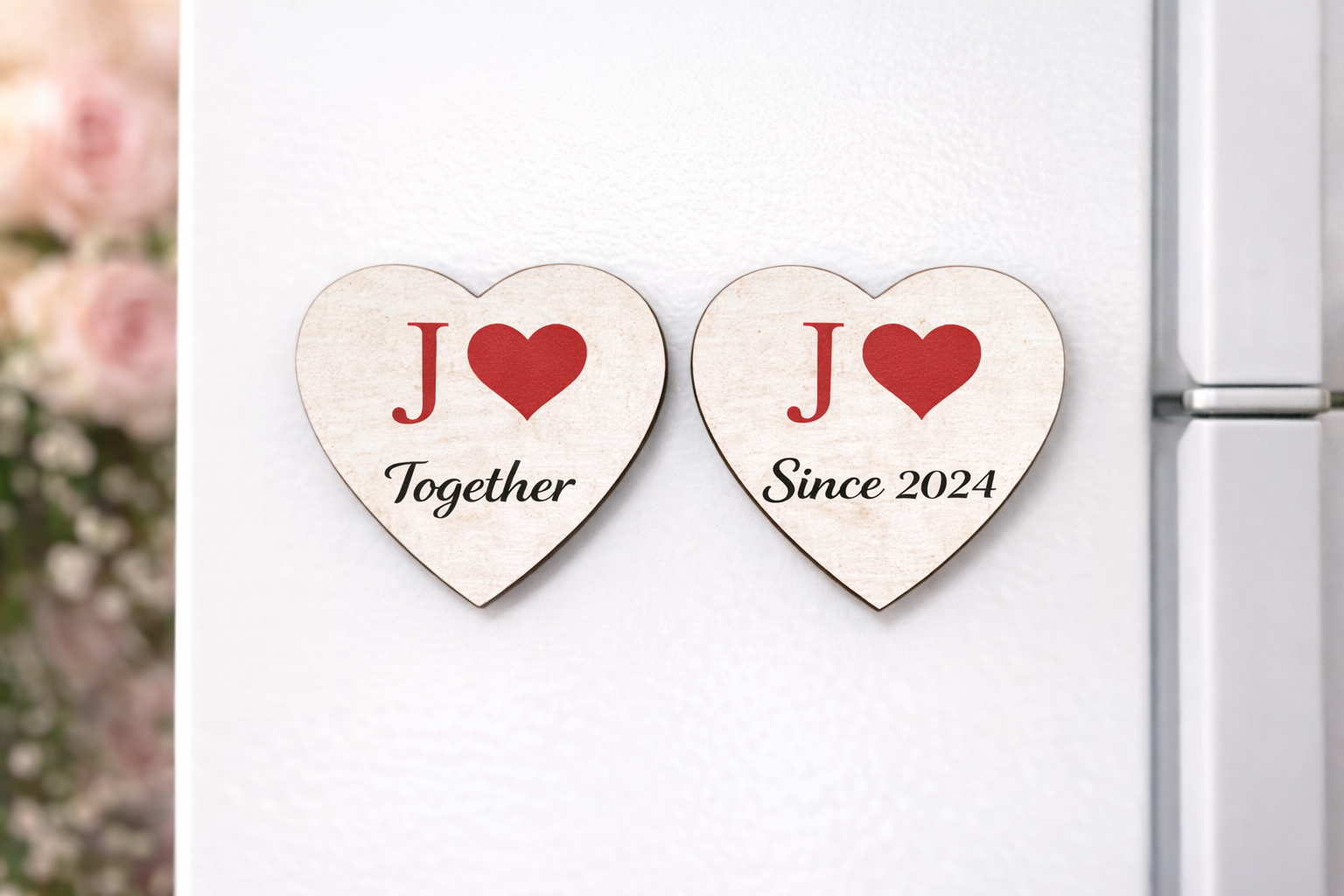 Two heart-shaped magnets on a refrigerator with 'JO Together Since 2024' text.